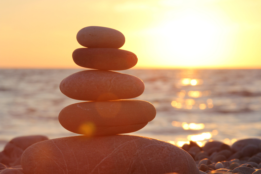 Zen stones sunset sea peace of mind concept